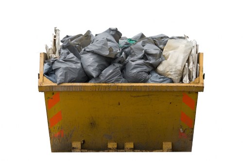 Yeading muck away team using advanced equipment for waste disposal