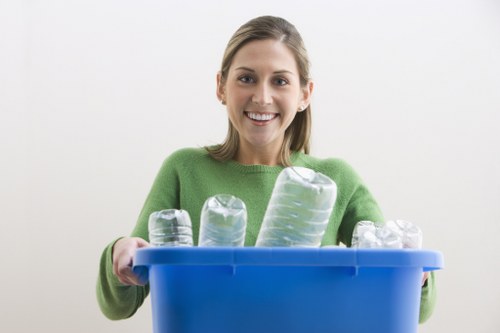 Team of movers carefully packing household items